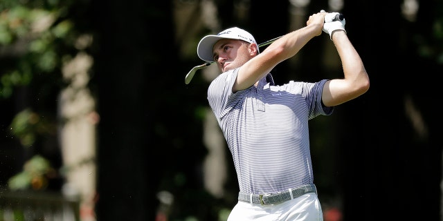 Justin Thomas hits toward the ninth green during the second round of the Memorial golf tournament, Friday, July 17, 2020, in Dublin, Ohio. (AP Photo/Darron Cummings)