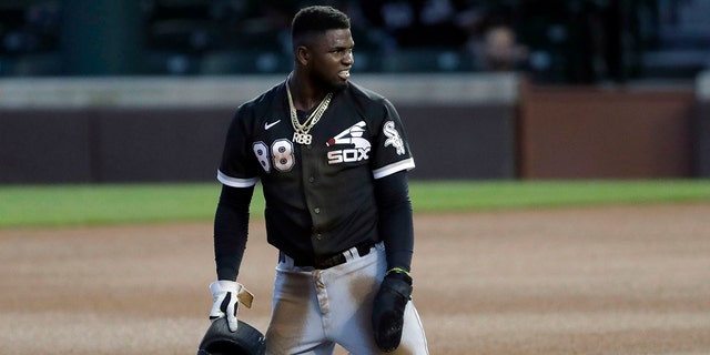 Chicago White Sox's Luis Robert reacts after he was tagging out by Chicago Cubs second baseman Nico Hoerner during the fourth inning of an exhibition baseball game at Wrigley Field in Chicago, Sunday, July 19, 2020. (AP Photo/Nam Y. Huh)