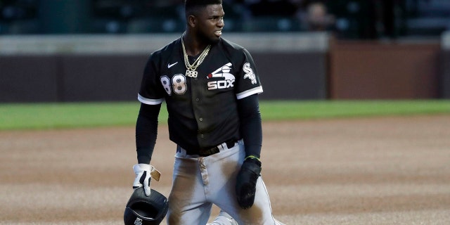 Chicago White Sox's Luis Robert reacts after he was tagging out by Chicago Cubs second baseman Nico Hoerner during the fourth inning of an exhibition baseball game at Wrigley Field in Chicago, Sunday, July 19, 2020. (AP Photo/Nam Y. Huh)