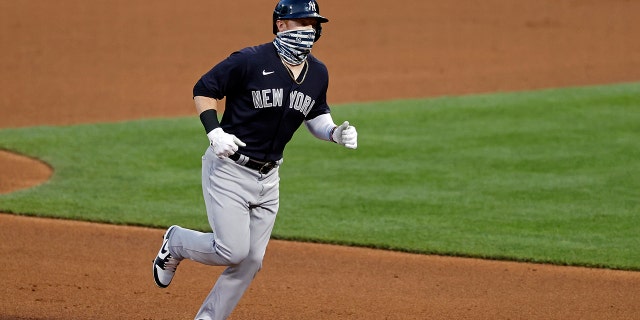 New York Yankees' Clint Frazier rounds the bases after hitting a two-run home run against the New York Mets during the fourth inning of a baseball spring training game Saturday, July 18, 2020, in New York. (AP Photo/Adam Hunger)