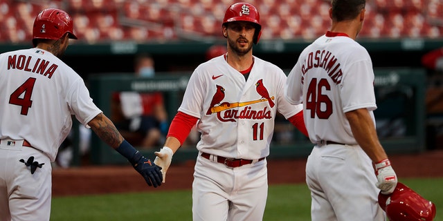St. Louis Cardinals' Paul DeJong (11) is congratulated by teammates Yadier Molina (4) and Paul Goldschmidt (46) after hitting a two-run home run during an intrasquad practice baseball game at Busch Stadium Thursday, July 9, 2020, in St. Louis. (AP Photo/Jeff Roberson)
