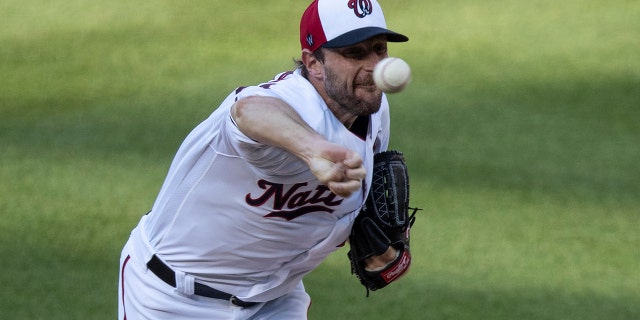 Washington Nationals starting pitcher Max Scherzer throws during the first inning of an exhibition baseball game against the Philadelphia Phillies at Nationals Park, Saturday, July 18, 2020, in Washington. (AP Photo/Alex Brandon)