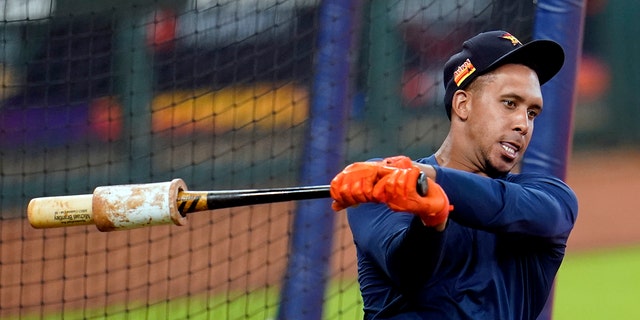 Houston Astros left fielder Michael Brantley warms up before taking batting practice during a baseball workout Wednesday, July 15, 2020, in Houston. (AP Photo/David J. Phillip)