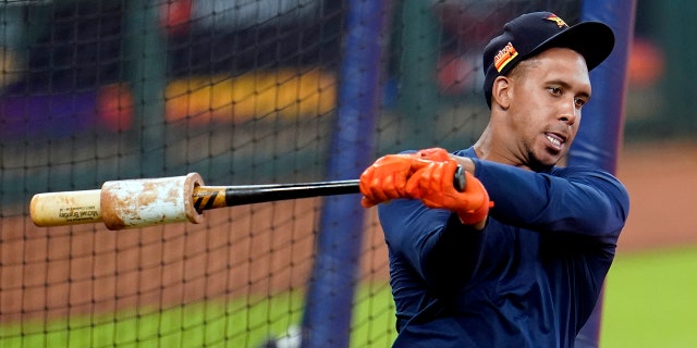 Houston Astros left fielder Michael Brantley warms up before taking batting practice during a baseball workout Wednesday, July 15, 2020, in Houston. (AP Photo/David J. Phillip)