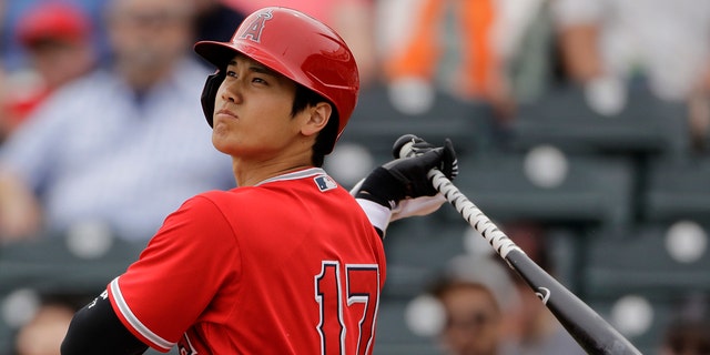 FILE - In this Feb. 28, 2020, file photo, Los Angeles Angels' Shohei Ohtani bats during the first inning of a spring training baseball game against the Texas Rangers, in Tempe, Ariz. (AP Photo/Charlie Riedel, File)