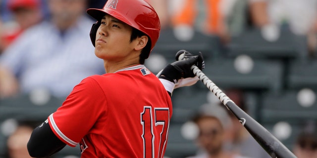 FILE - In this Feb. 28, 2020, file photo, Los Angeles Angels' Shohei Ohtani bats during the first inning of a spring training baseball game against the Texas Rangers, in Tempe, Ariz. (AP Photo/Charlie Riedel, File)