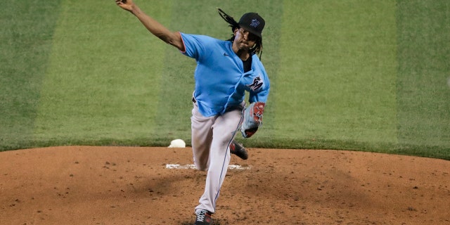 Miami Marlins' Jose Urena pitches during a baseball workout at Marlins Park, Thursday, July 16, 2020, in Miami. (AP Photo/Wilfredo Lee)