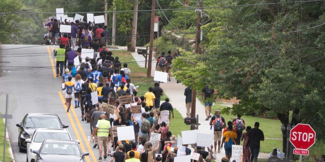 Dozens of protestors march to remove the monument led by the Atlanta chapter of NAACP. Source: Albert Fields / AlbertMultimedia.com