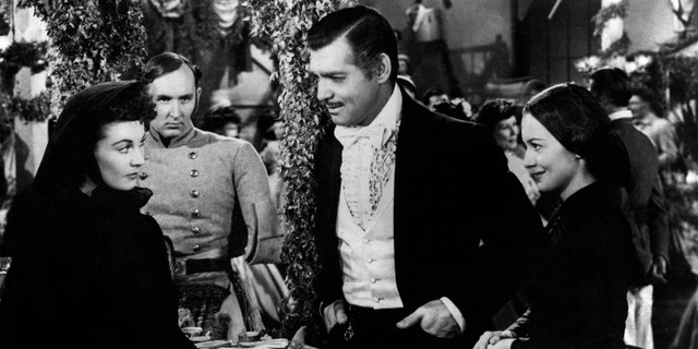 Actors Vivien Leigh, Clark Gable and Olivia De Havilland play the roles of Scarlett O'Hara, Rhett Butler and Melanie Hamilton respectively in Gone with the Wind by Victor Fleming. United States. 1939. (Photo by Mondadori via Getty Images)