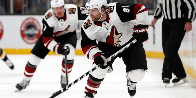 In this Feb. 8, 2020, file photo, Arizona Coyotes' Phil Kessel (81) moves the puck during the second period of an NHL hockey game against the Boston Bruins, in Boston. Injuries led to a disappointing first season in Arizona for Phil Kessel. Now that he's had time to heal up during the NHL's pause to the season, the high-scoring forward could help the Coyotes make a deep run once the season resumes. (AP Photo/Winslow Townson, File)