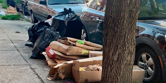 Trash rests piled up on a street Tuesday, July 28, 2020, in the Kensington neighborhood of Philadelphia.  (Kara Kneidl via AP)