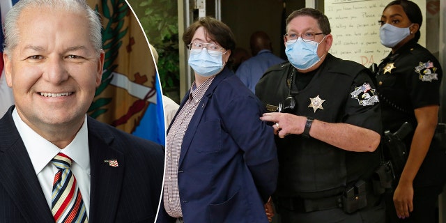 Protestors are escorted out of the office of Oklahoma County District Attorney David Prater in handcuffs at closing time, after staging a sit-in and refusing to leave, Monday, July 20, 2020, in Oklahoma City.