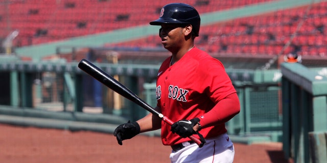 Boston Red Sox's Rafael Devers heads to the plate for an at-bat during an intra-squad game at Fenway Park on Thursday, July 9, 2020, in Boston. (AP Photo/Charles Krupa)