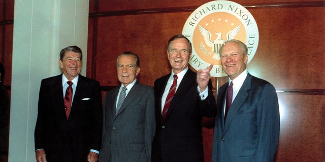 FILE – Former U.S. presidents Ronald Reagan, left, Richard Nixon, and Gerarld Ford, far right, pose with U.S. President George Bush, second from right, in the Richard Nixon Library and Birthplace in Yorba Linda, Ca., July 19, 1990.  (AP Photo/Barry Thumma)