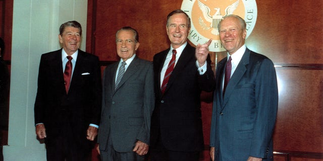 FILE – Former U.S. presidents Ronald Reagan, left, Richard Nixon, and Gerarld Ford, far right, pose with U.S. President George Bush, second from right, in the Richard Nixon Library and Birthplace in Yorba Linda, Ca., July 19, 1990.  (AP Photo/Barry Thumma)