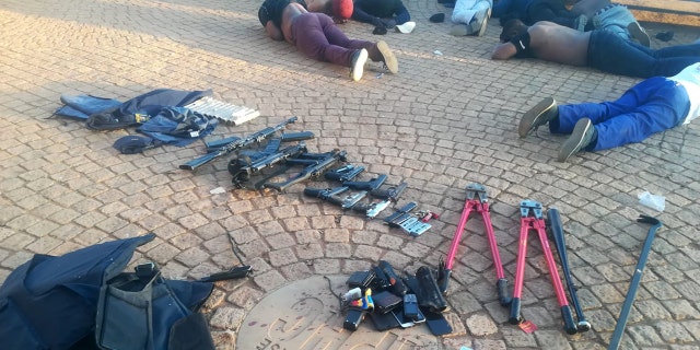 South African police seized weapons and made more than 40 arrests after responding to a hostage situation at International Pentcost Holiness Church, Zuurbekom, overnight Saturday.