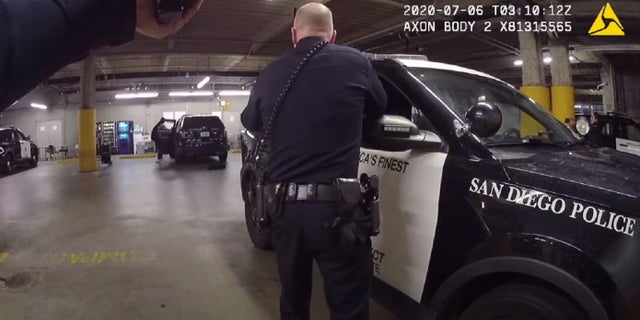 A man was shot at San Diego police headquarters Sunday after he slipped off his handcuffs, grabbed an officer's gun from a backpack inside a police SUV and fired, police said.