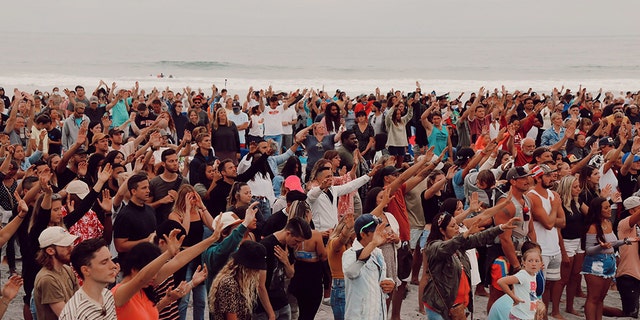 Around 5,000 people gathered at the "Let Us Worship" event on a San Diego, Calif. beach Sunday, July 26, 2020.