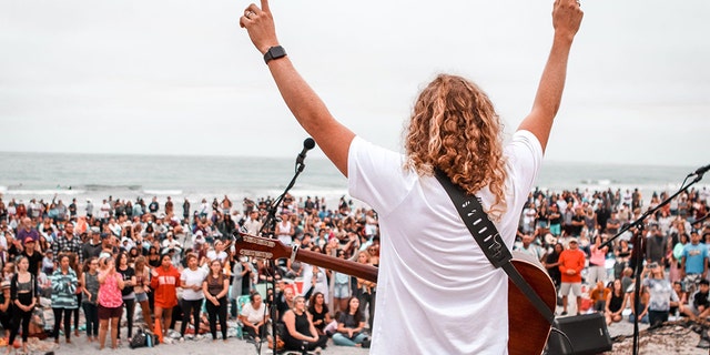 Sean Feucht, founder of Hold the Line, leads worship at the beach in San Diego, Calif. Sunday, July 26, 2020.