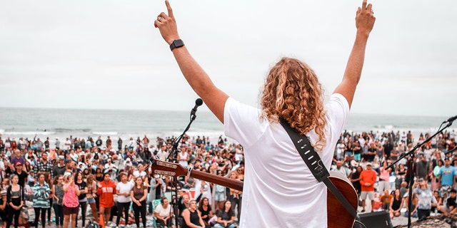 Sean Feucht, founder of Hold the Line, leads worship at the beach in San Diego, Calif. Sunday, July 26, 2020.