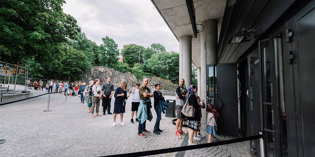 People queue to visit the Vasa Museum in Stockholm on July 15, 2020 on the day of its reopening amid the new coronavirus pandemic. (STINA STJERNKVIST/TT News Agency/AFP via Getty Images)