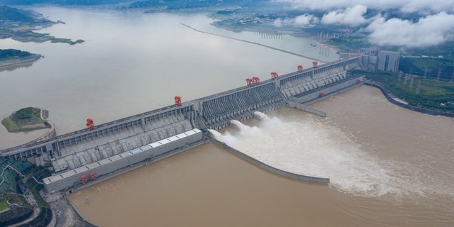 The Three Gorges dam is discharging flood. Yichang City, Hubei Province, China, July 2. The dam has come under new scrutiny after devastating flooding over the past few weeks.