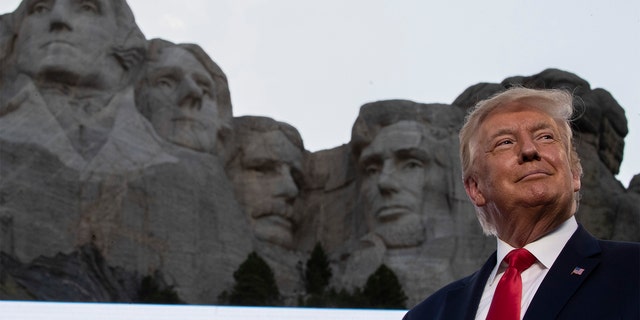 Former President Donald Trump smiles at Mount Rushmore National Memorial, Friday, July 3, 2020, near Keystone, S.D. (Associated Press)