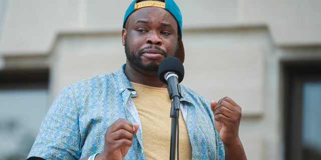 Vauhxx Booker speaks during a community gathering to fight against racism. (SOPA Images/LightRocket via Getty Images)