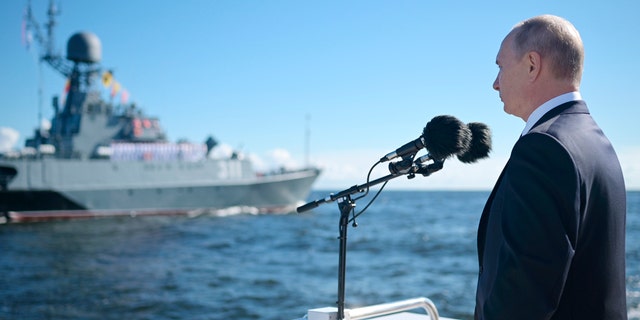 President Vladimir Putin inspects warships during the Navy Day parade in St.Petersburg, Russia, on Sunday, July 26, 2020. (Alexei Druzhinin, Sputnik, Kremlin Pool Photo via AP)