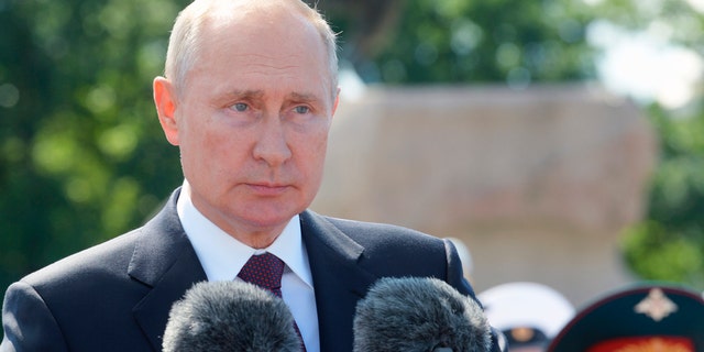 President Vladimir Putin attends the Navy Day parade in St.Petersburg, Russia, on Sunday, July 26, 2020. (Alexei Druzhinin, Sputnik, Kremlin Pool Photo via AP)