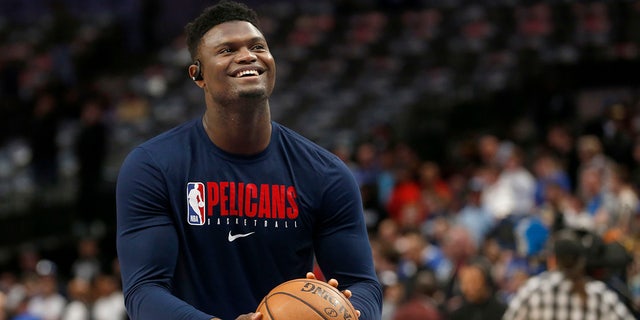 In this March 4, 2020, file photo, New Orleans Pelicans forward Zion Williamson shoots free throws prior to an NBA basketball game against the Dallas Mavericks in Dallas. (AP Photo/Michael Ainsworth)