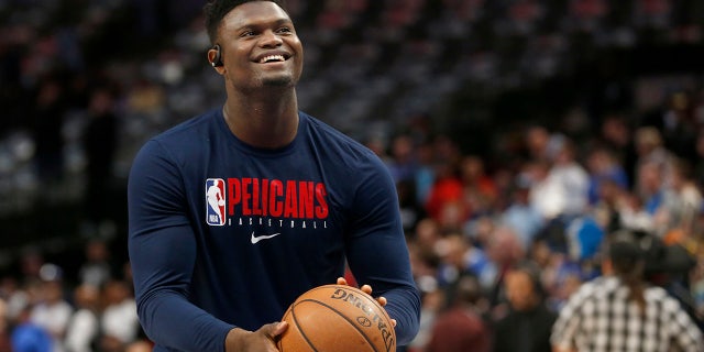 FILE - In this March 4, 2020, file photo, New Orleans Pelicans forward Zion Williamson shoots free throws prior to an NBA basketball game against the Dallas Mavericks in Dallas. Pelicans rookie Williamson says he feels like he is in good shape as he prepares to help lead New Orleans' eight-game push to make the NBA playoffs. (AP Photo/Michael Ainsworth)