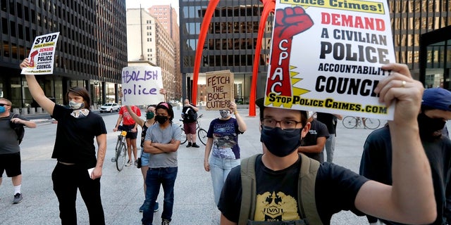 Protesters gather on Federal Plaza on Thursday after a collection of Chicago groups announced a federal lawsuit against the Chicago Police Department and others to prevent agents from making arrests or detaining people without probable cause. (AP Photo/Charles Rex Arbogast)