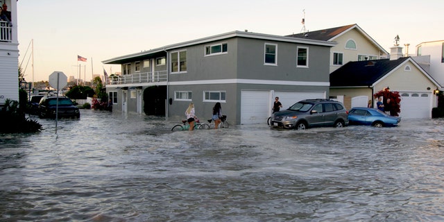 Streets in the Balboa Peninsula are flooded by coastal tides and high surf in Newport Beach, Calif., July 3.