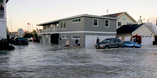 Streets in the Balboa Peninsula are flooded by coastal tides and high surf in Newport Beach, Calif., July 3.