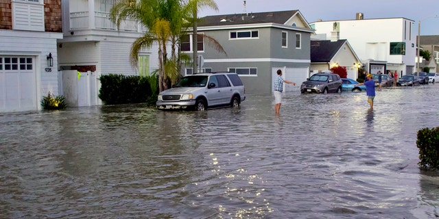 Homes and streets near the coastline are seen flooded with seawater in Newport Beach, Calif., July 3.