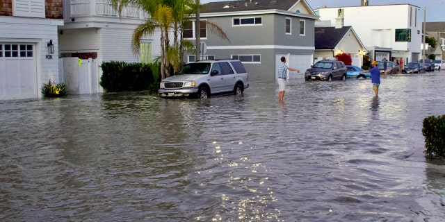 Homes and streets near the coastline are seen flooded with seawater in Newport Beach, Calif., July 3.