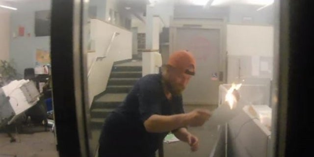 Prosecutors believe Thomas Schinzing spread a May 29 fire in the Corrections Records Office of Portland's Justice Center by moving flaming papers into separate cubicles.