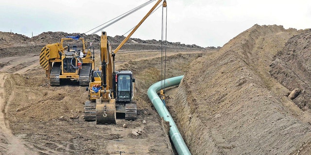 In this Oct. 5, 2016, file photo, heavy equipment is seen at a site where sections of the Dakota Access pipeline were being buried near the town of St. Anthony in Morton County, N.D. (Tom Stromme/The Bismarck Tribune via AP, File)