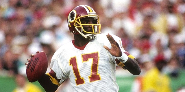 Quarterback Doug Williams #10 of the Washington Redskins drops back to pass during Super Bowl XXII against the Denver Broncos at Jack Murphy Stadium on January 31, 1988 in San Diego, California. The Redskins won 42-10. (Photo by George Rose/Getty Images)