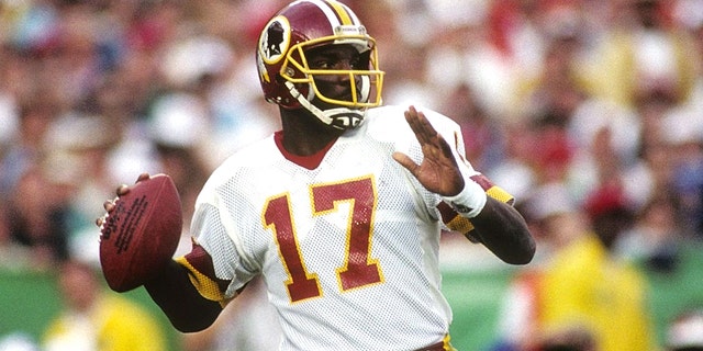 Quarterback Doug Williams #10 of the Washington Redskins drops back to pass during Super Bowl XXII against the Denver Broncos at Jack Murphy Stadium on January 31, 1988 in San Diego, California. The Redskins won 42-10. (Photo by George Rose/Getty Images)