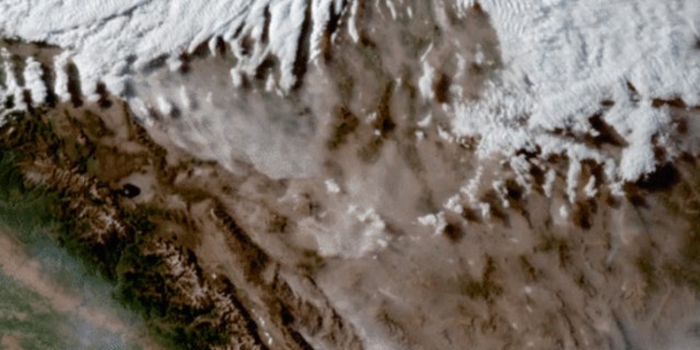 A dust storm can be seen racing across Nevada's Mojave Desert on June 28.