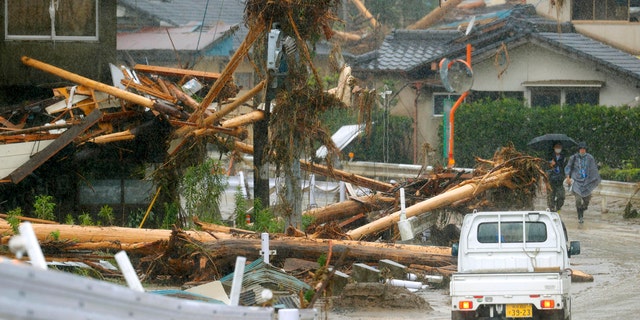 Debris are seen on a residential area hit by heavy rain in Kumamura, Kumamoto prefecture, southern Japan Tuesday, July 7, 2020.