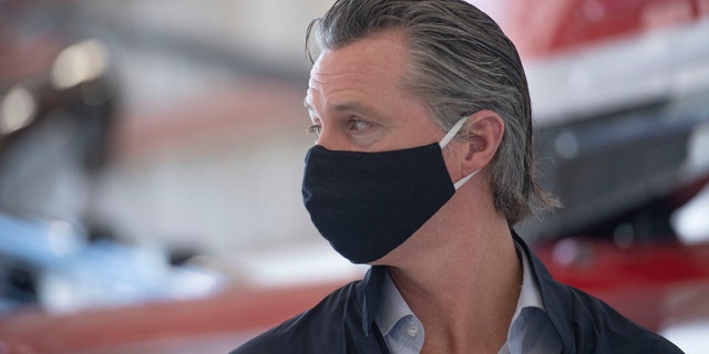 California Gov. Gavin Newsom visits the California Department of Forestry and Fire Protection's McClellan Reload Base in Sacramento, Calif. (Associated Press)