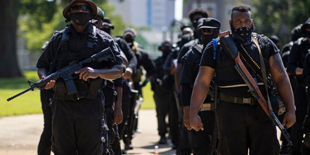 Members of a protestor group affiliated with NFAC, most carrying firearms, gather to march on July 25, 2020 in Louisville, Kentucky. The group is marching in response to the killing of Breonna Taylor. (Photo by Brett Carlsen/Getty Images)