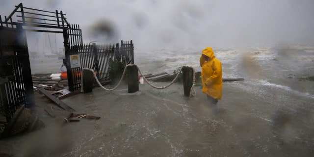 Jame Rowles examines the damage after the docks at the marina where his boat was secured were destroyed as Hurricane Hanna made landfall, Saturday, July 25, 2020, in Corpus Christi, Texas.