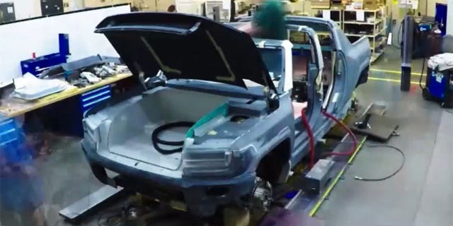 The HUMMER EV features a front trunk storage compartment with an electric motor tucked underneath it.