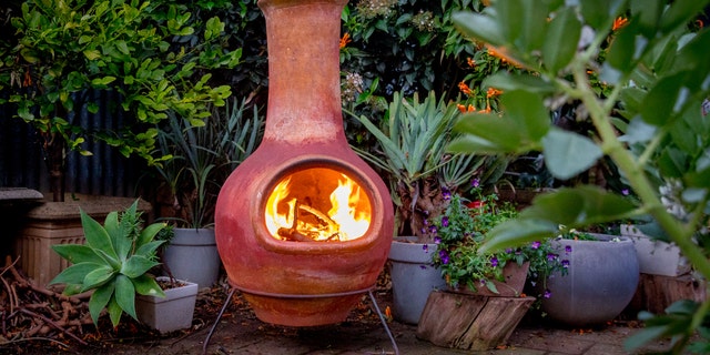 The classic chiminea, the Spanish word for chimney, burns by design like a fireplace.