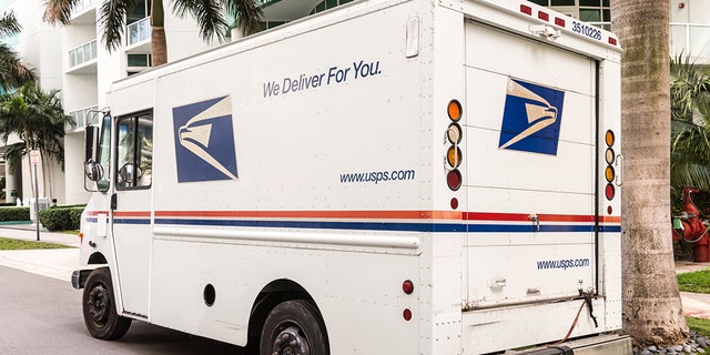 A United States Post Office mail truck (USPS) parked in Miami, Florida