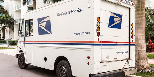 A United States Post Office mail truck (USPS) parked in Miami, Florida